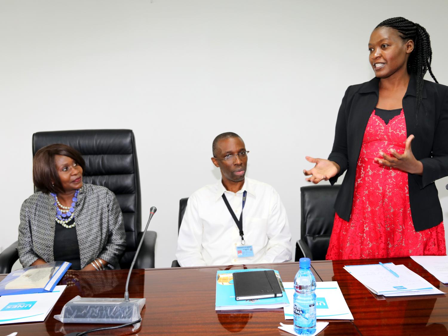 A picture of three academics at a table