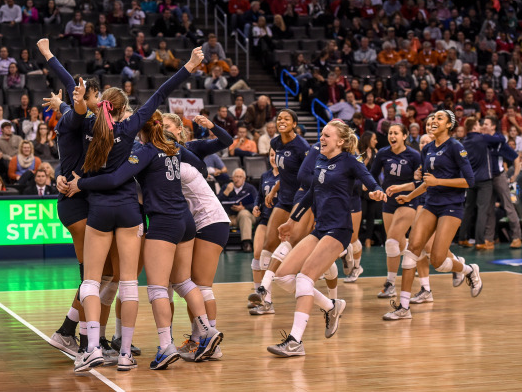 The Penn State women's volleyball team celebrates match point after defeating Stanford in the 2014 NCAA Semifinals