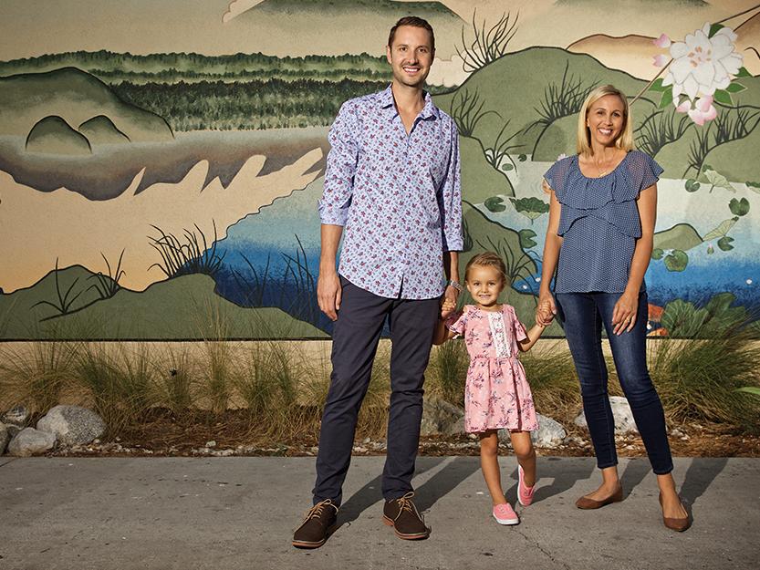 Erin Weidemann (right) with her husband, Brent, and daughter, Rooney