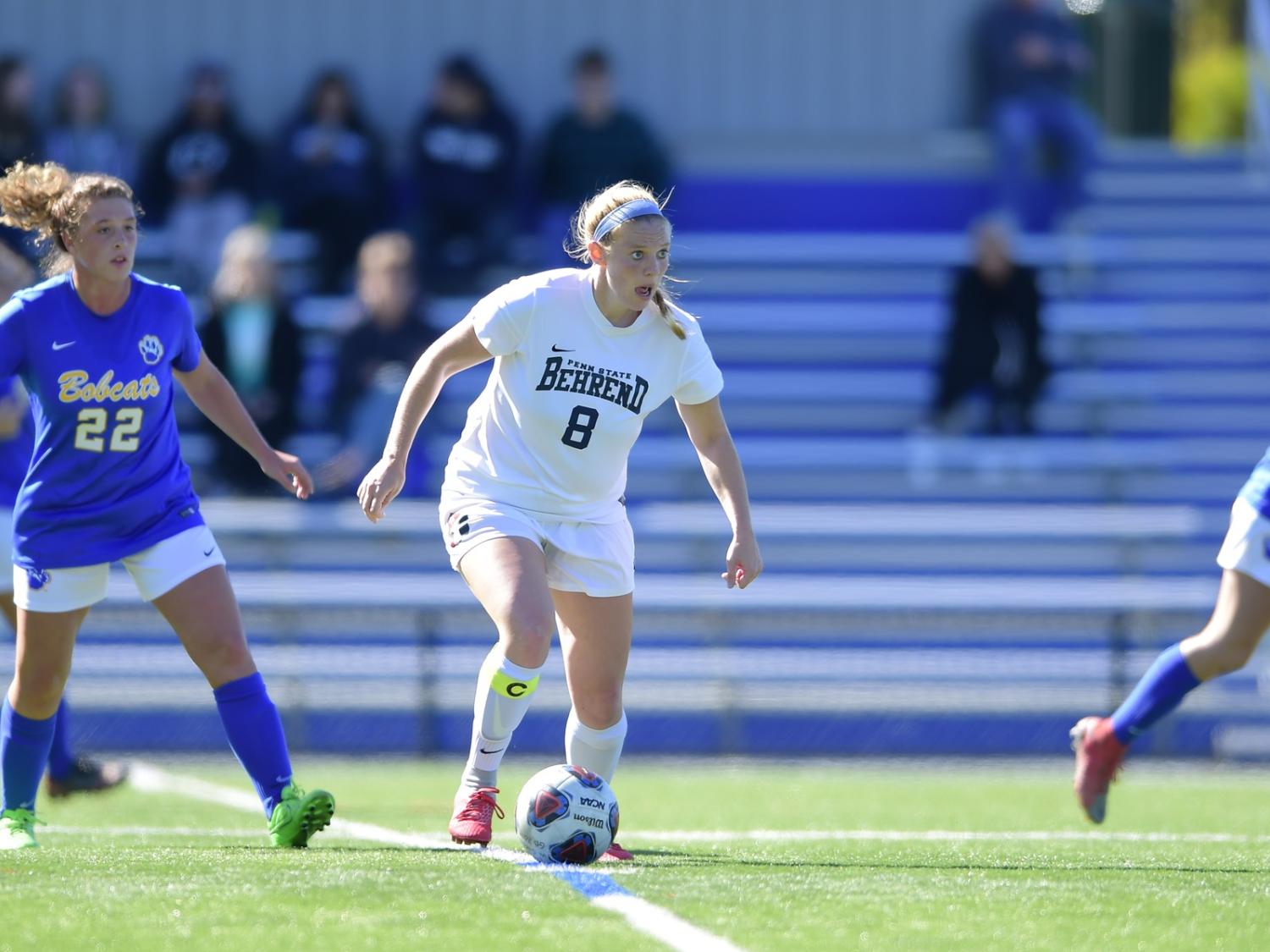 A Penn State Behrend soccer player advances toward the goal.