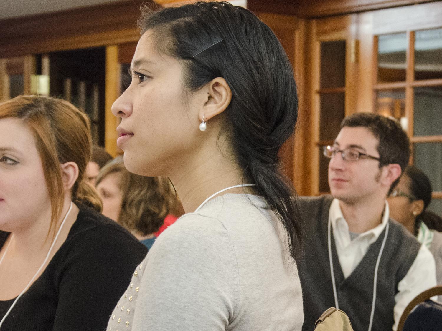 Young professionals look on as Susan Basso speaks