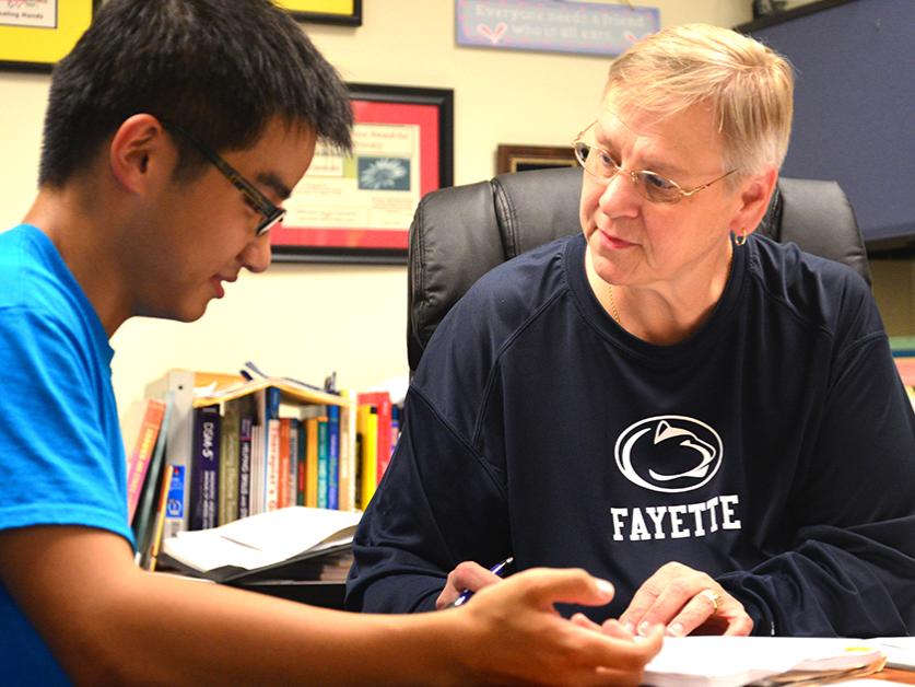 Jo Ann Jankoski conferences with a student.