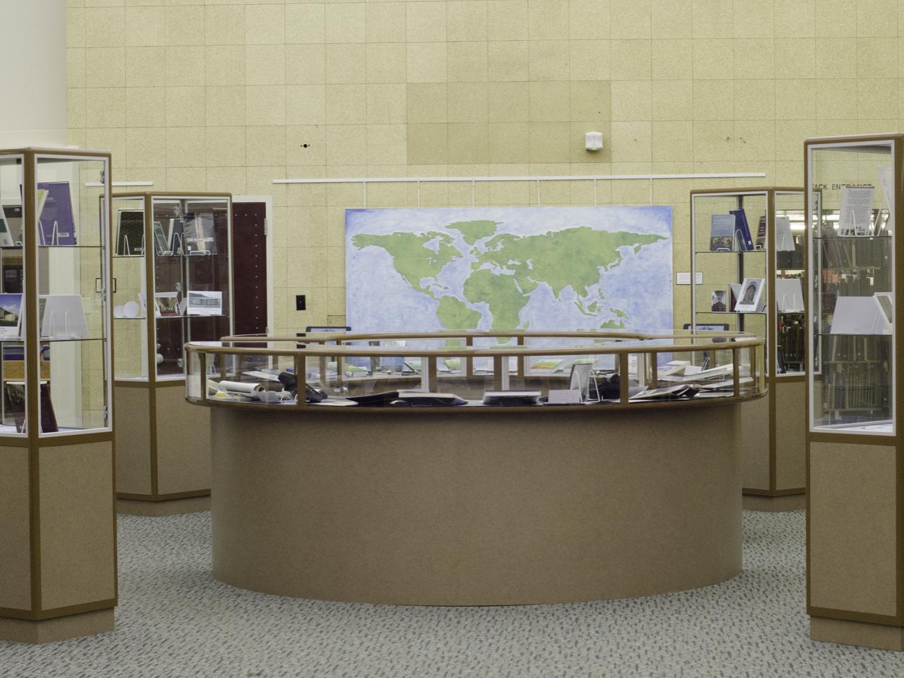 Photo of exhibit, including wall map and display cases