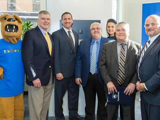 Penn State President Dr. Eric Barron is joined by Westmoreland County and New Kensington leadership for the opening of The Corner.