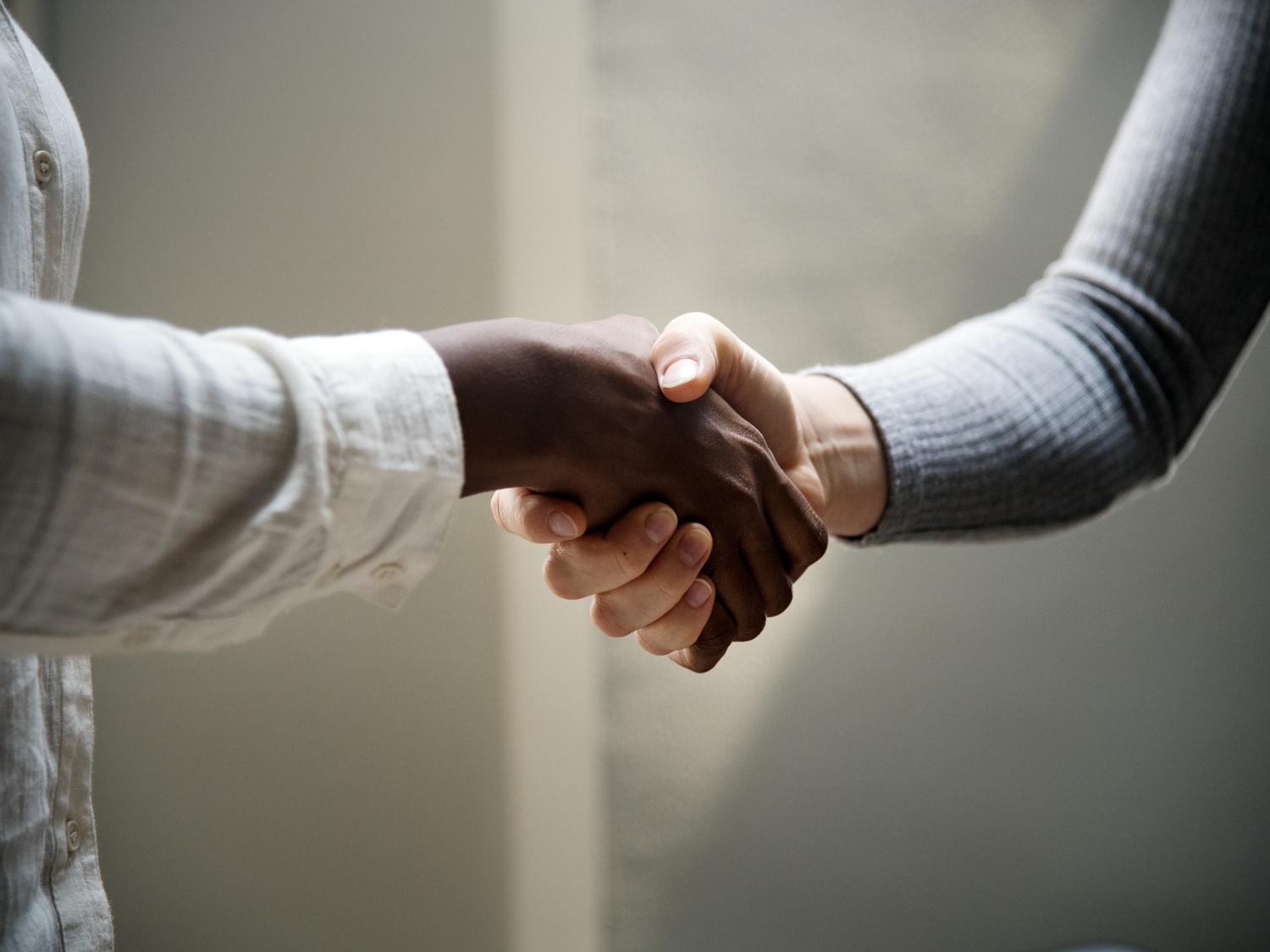 women shaking hands