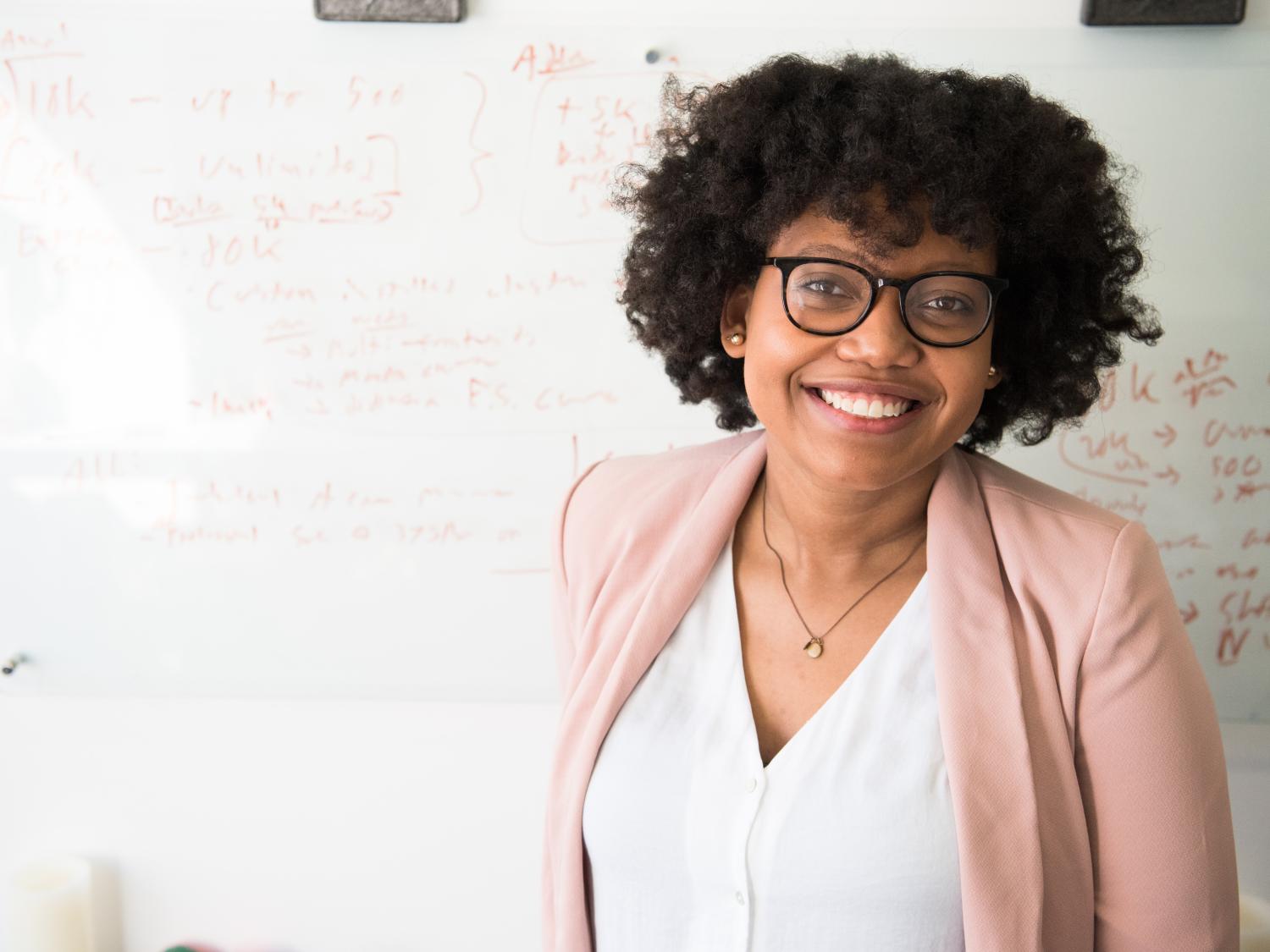 Woman in front of a white board