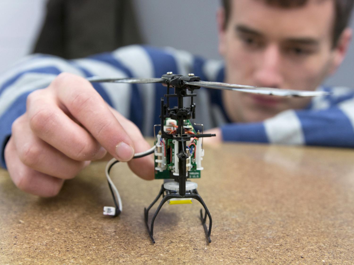 Penn State Graduate Engineering Student with tiny drone 