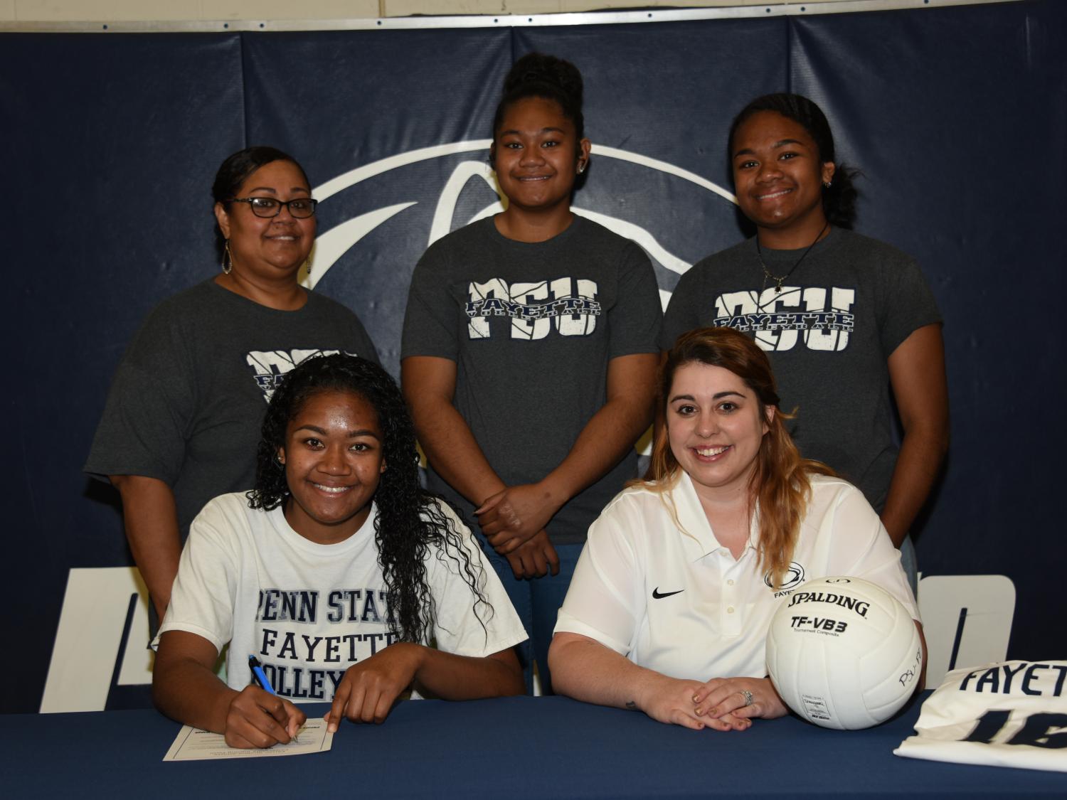 From left to right: Adi Buwawa, mother; Angel Buwawa; Bella Buwawa, sister; Samantha Swetz, Volleyball Head Coach; Emily Buwawa, sister.