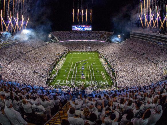 night aerial view of Penn State's Beaver Stadium with fireworks