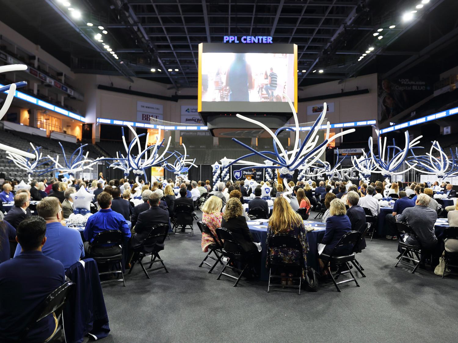 300 people seated at tables in PPL Center