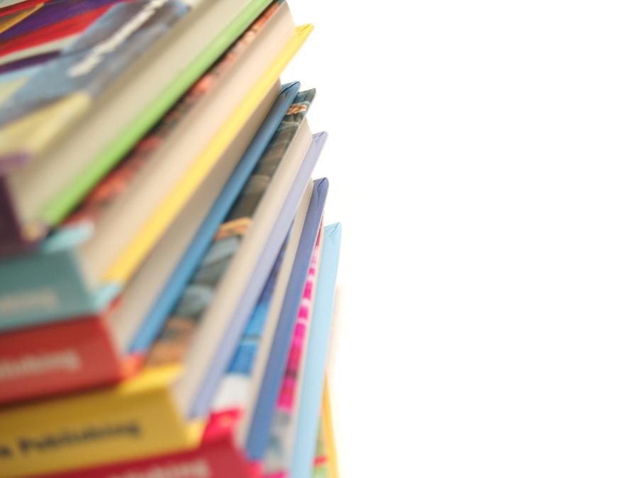 Various books are placed in a stack.
