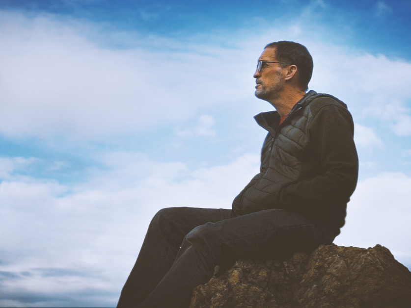 Man sitting on rock