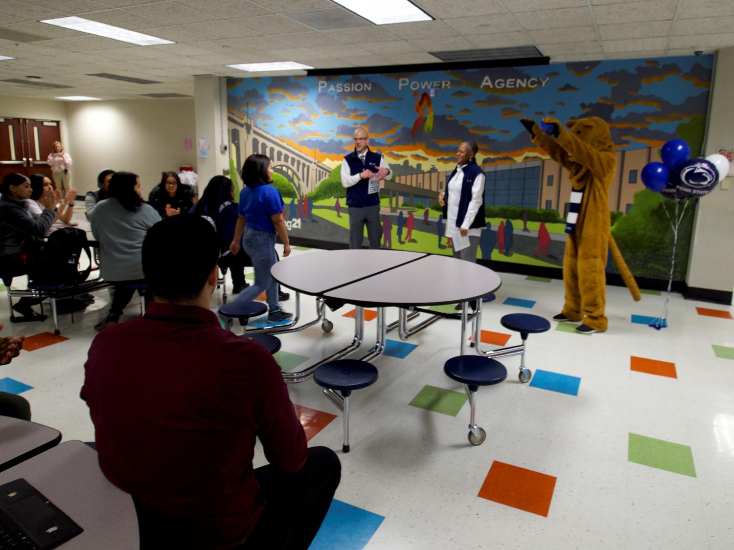 student walks to the front of cafeteria