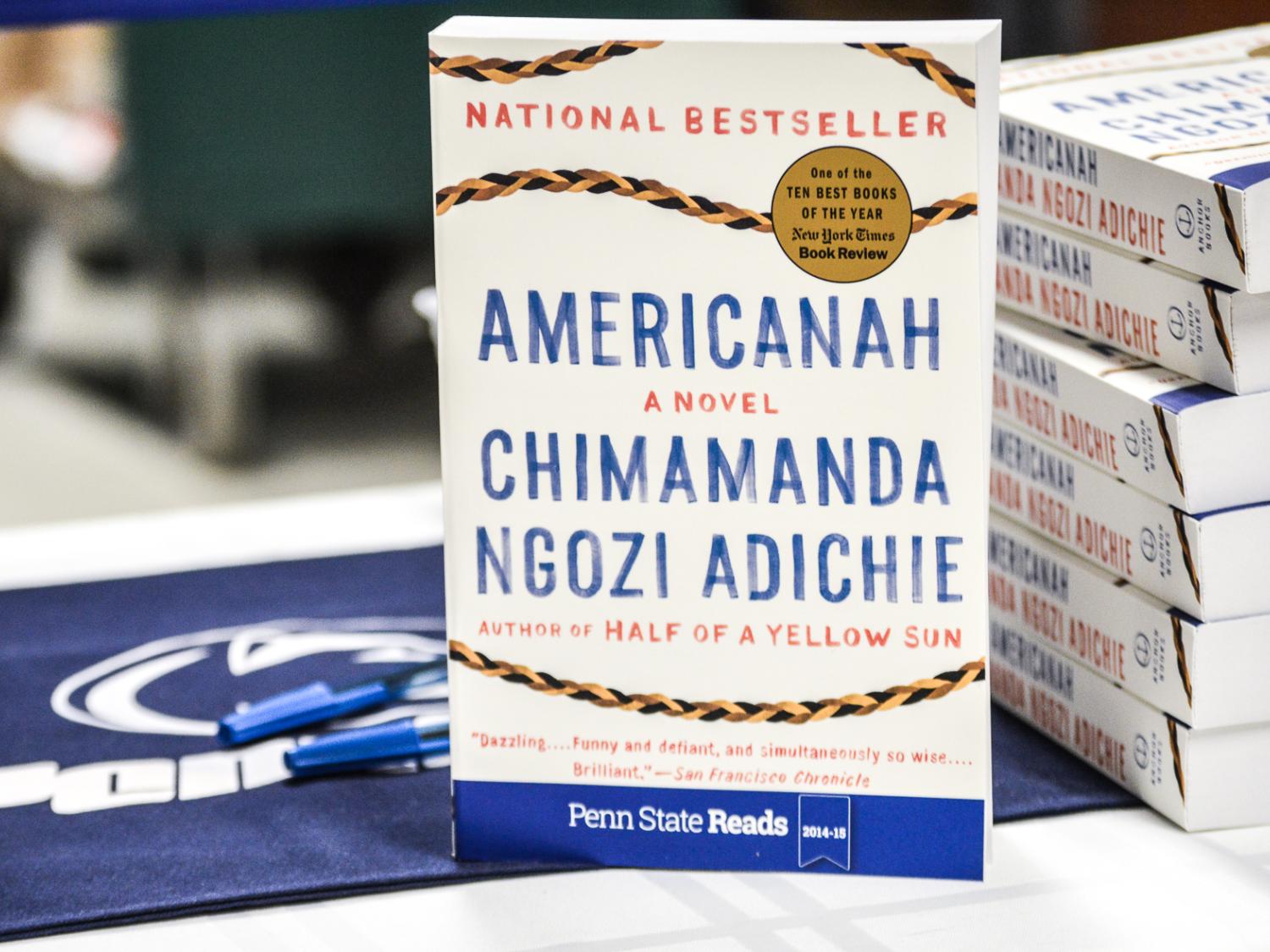 Photo of 'Americanah' book next to a stack of books