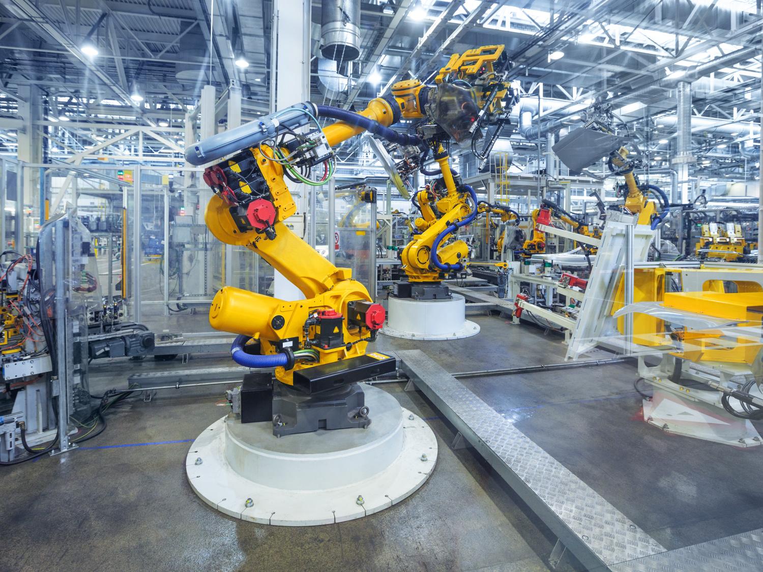 A production robot is used in a work environment.