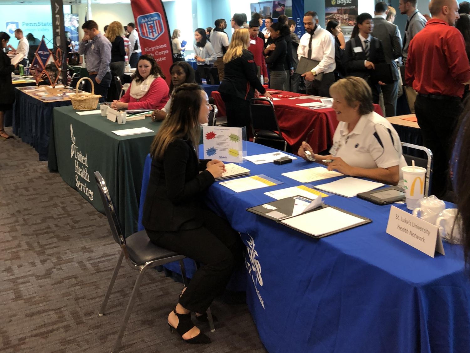 Student interacting at career fair
