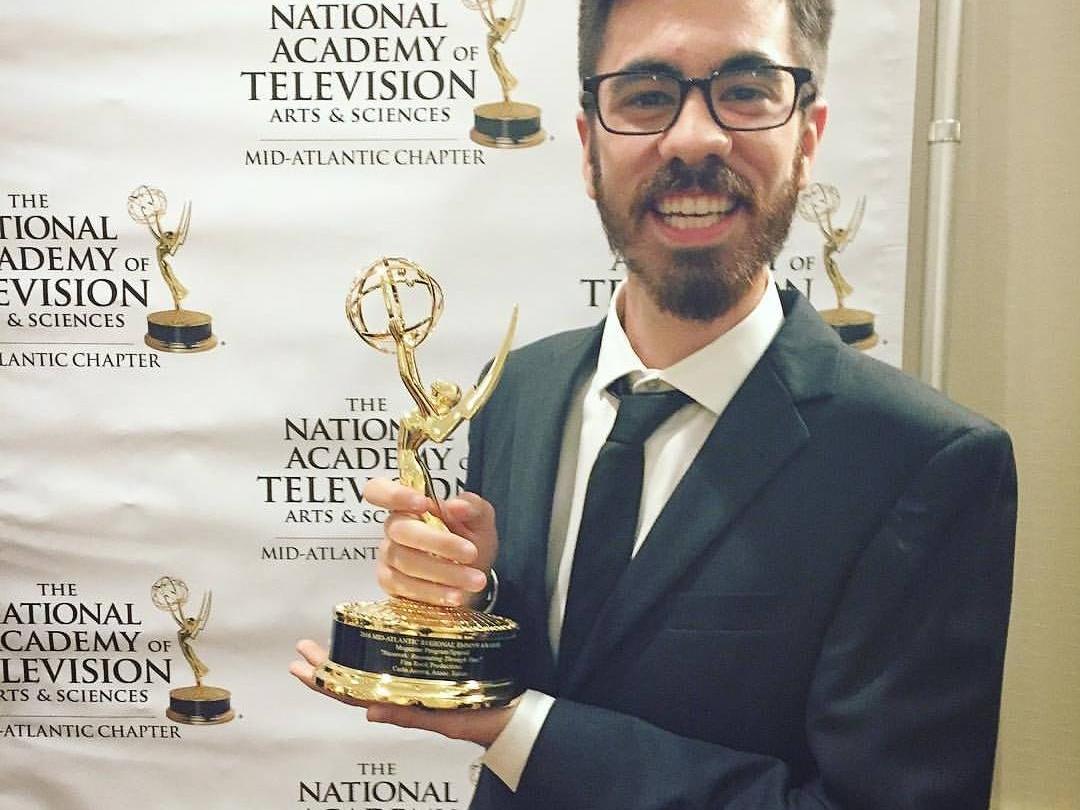 Carlo Acerra holding his Emmy