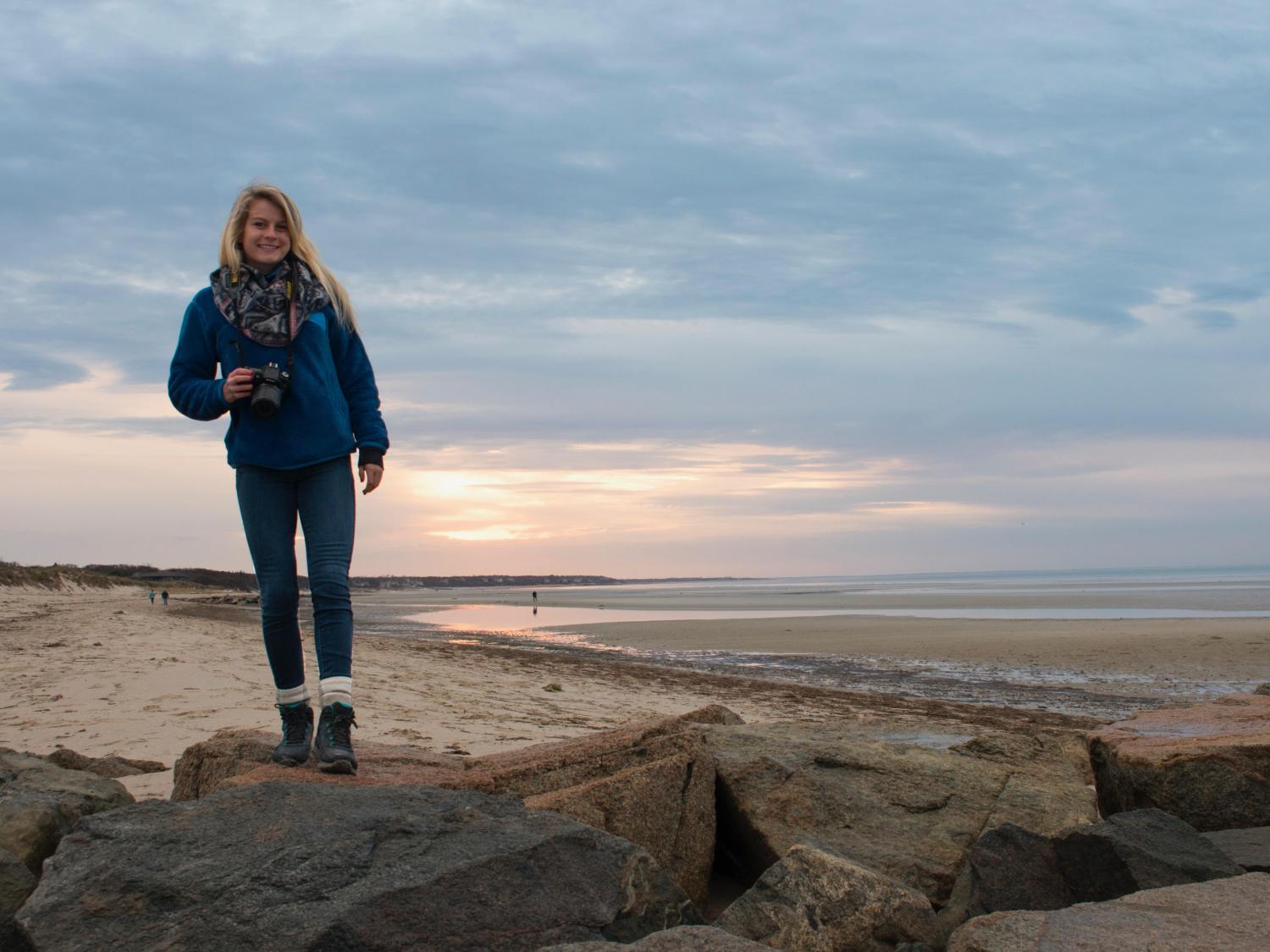 Caroline Rosini stands on a rock jetty.