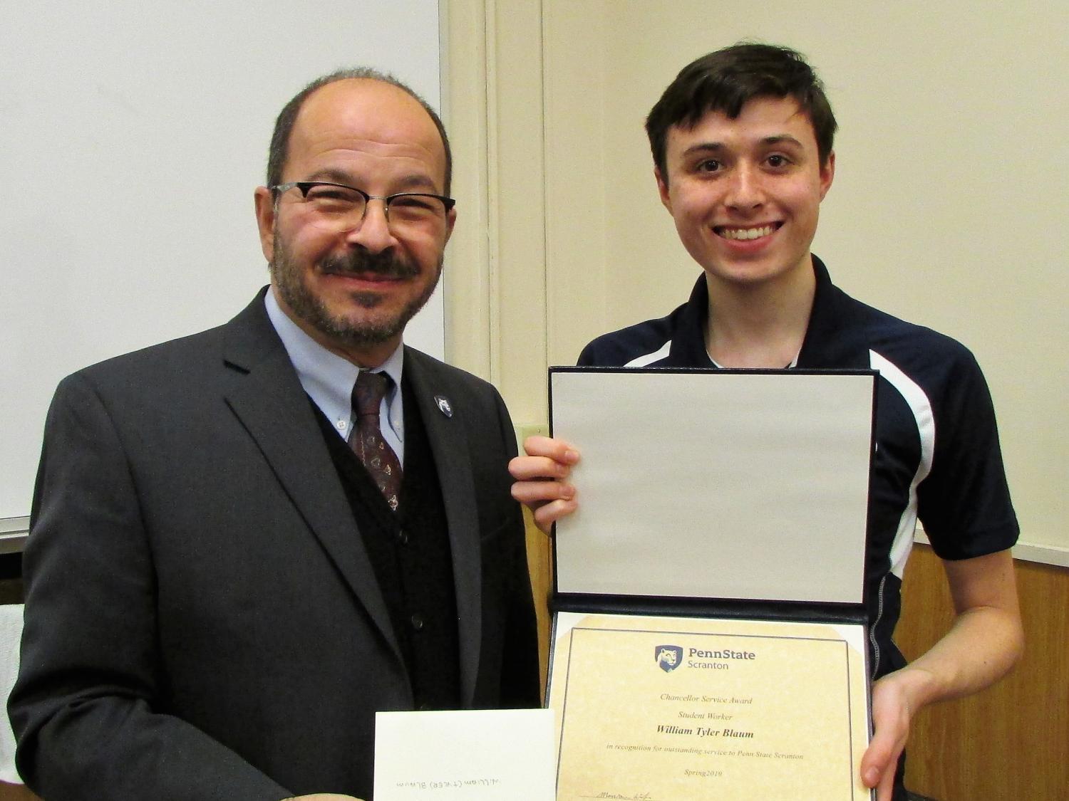 Blaum receiving award from Chancellor Marwan Wafa