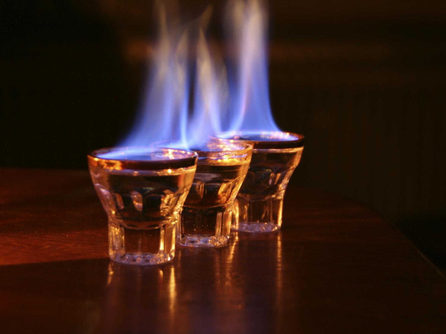 burning alcohol in shot glasses