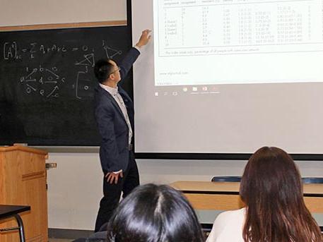 Qiushi Chen lecturing at the blackboard