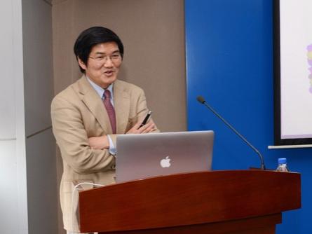 man at podium speaking