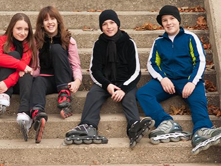 Four children sitting on steps