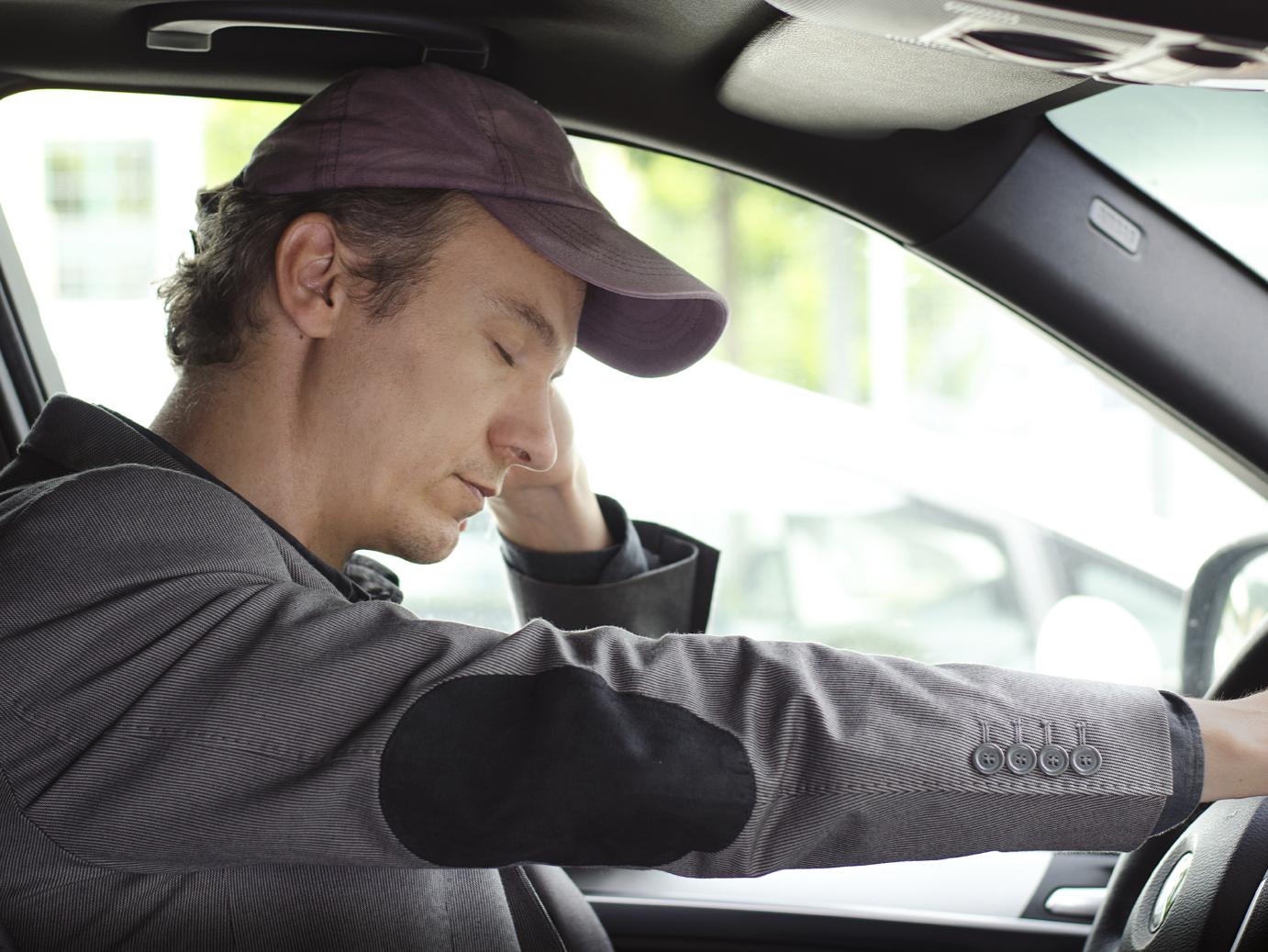 sleepy man driving car