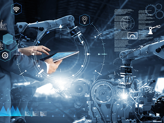 Text and graphics overlay a picture of a person holds an electronic tablet and stands beside a robotic arm