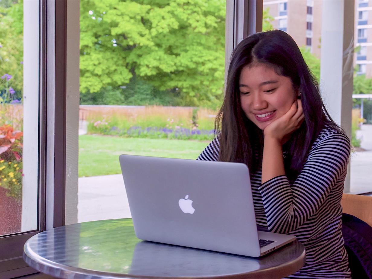Student using laptop in dorm