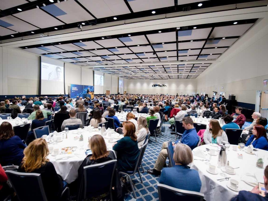 Overview of crowded President's Hall at the Penn Stater