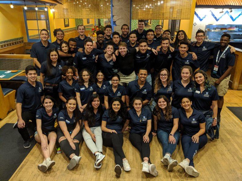 group of students smile and pose for a photo 