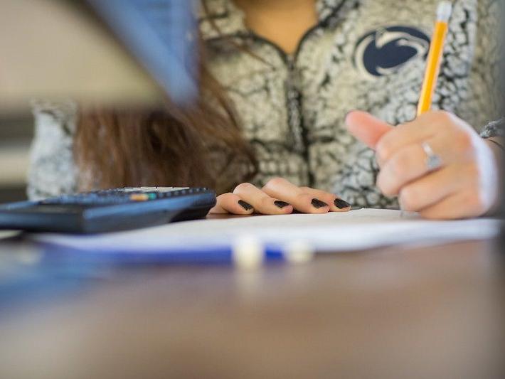 A student works on an engineering assignment. 