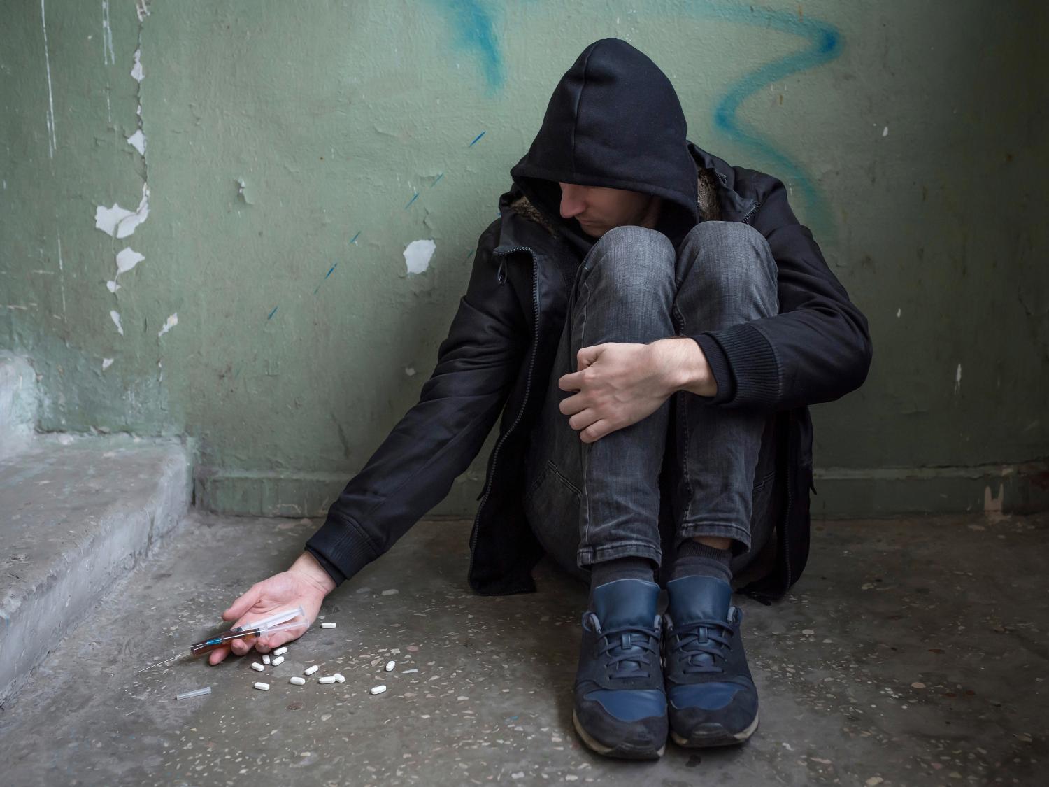 A drug addict with a syringe