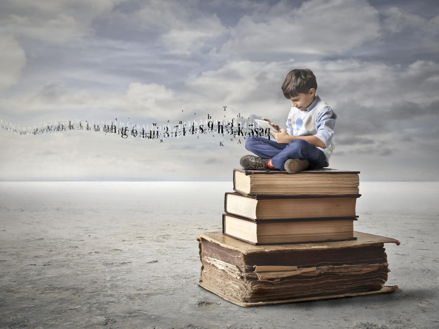 child on pile of books