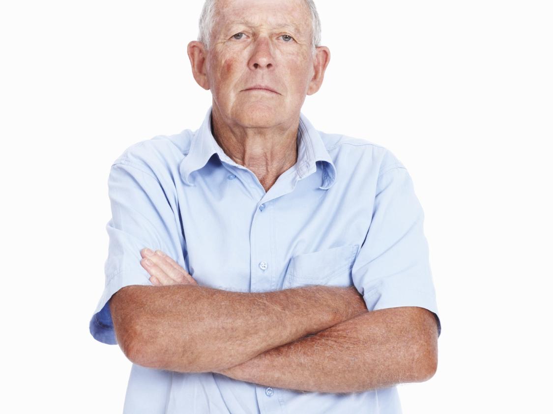 elderly man with arms crossed