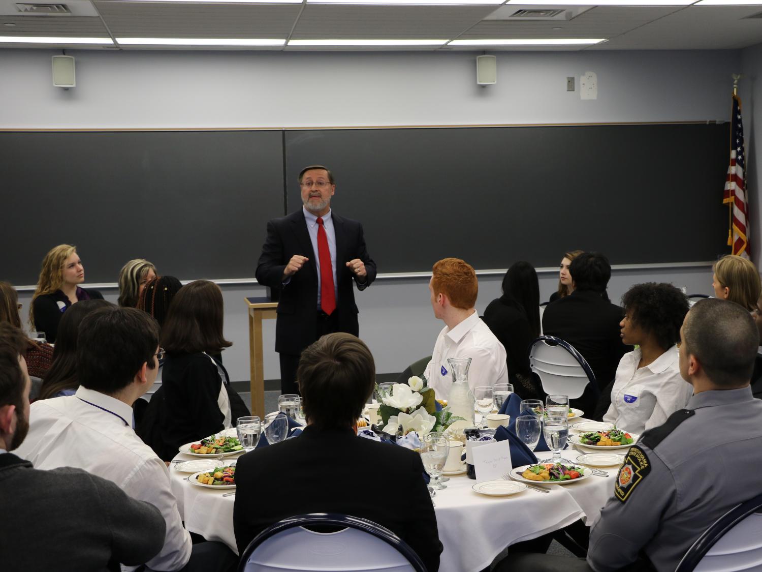 Michael True, a career services professional, leads last year's etiquette dinner at Penn State Hazleton.