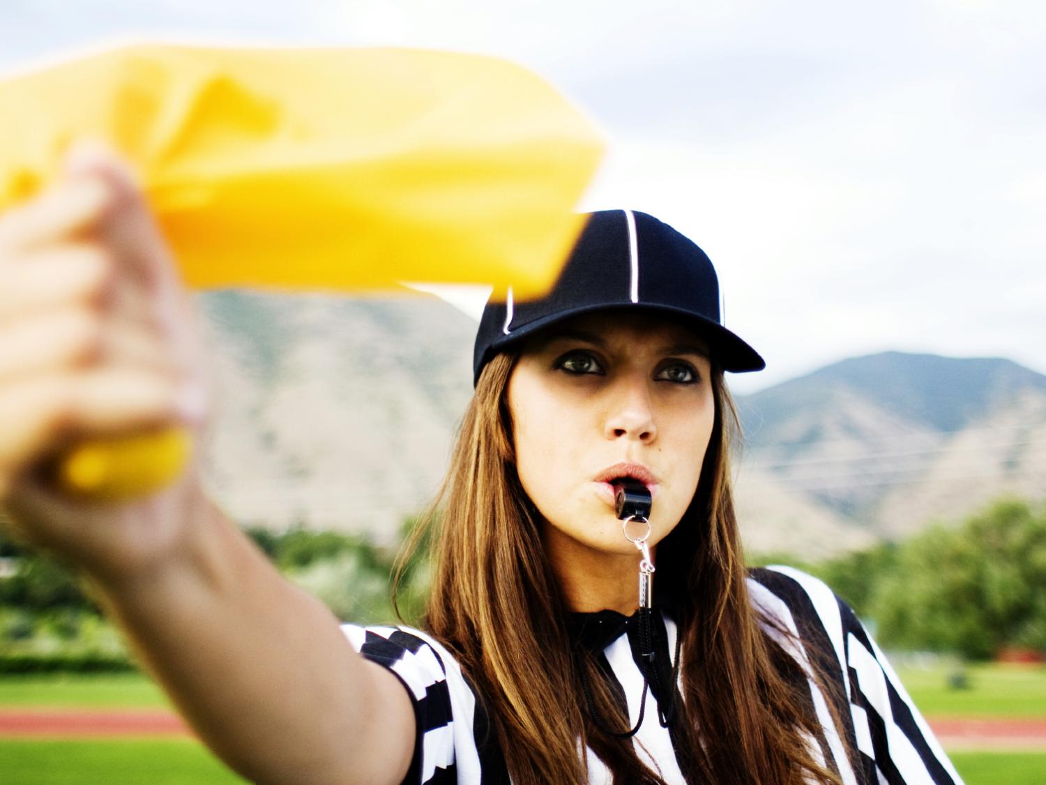 female ref throwing yellow flag