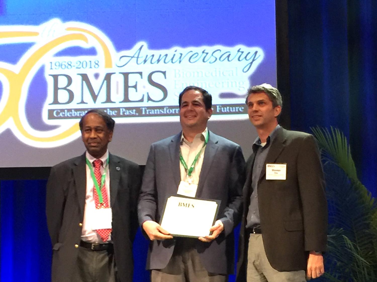 Keefe Manning, professor of biomedical engineering, (center) receives the Most Cited Article Award from Ajit Yoganathan, editor of the journal Cardiovascular Engineering and Technology, (left) and Steven Day, chair, biomedical engineering, Rochester Institute of Technology.