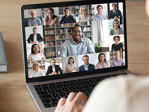 A laptop with a Zoom meeting on the screen