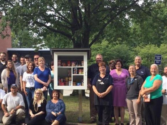 crowd gathered at little food pantry