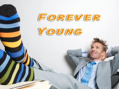 Young man in tie with striped colored socks propped up on desk
