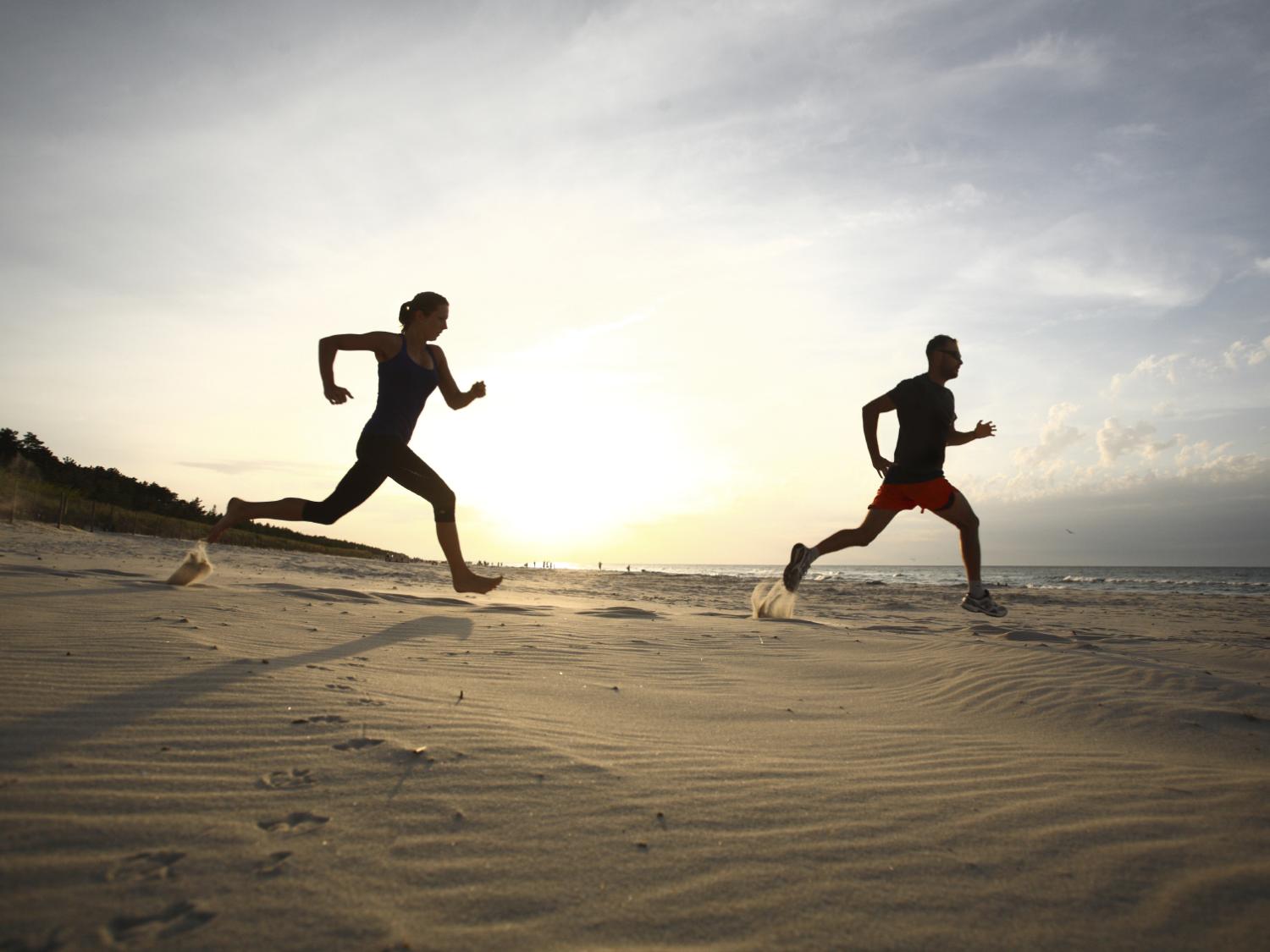 runners on a beach