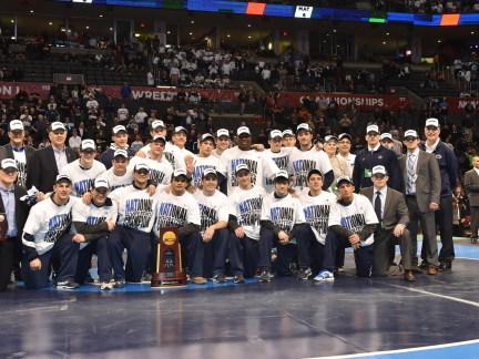The Penn State wrestling team celebrates its fourth consecutive national championship