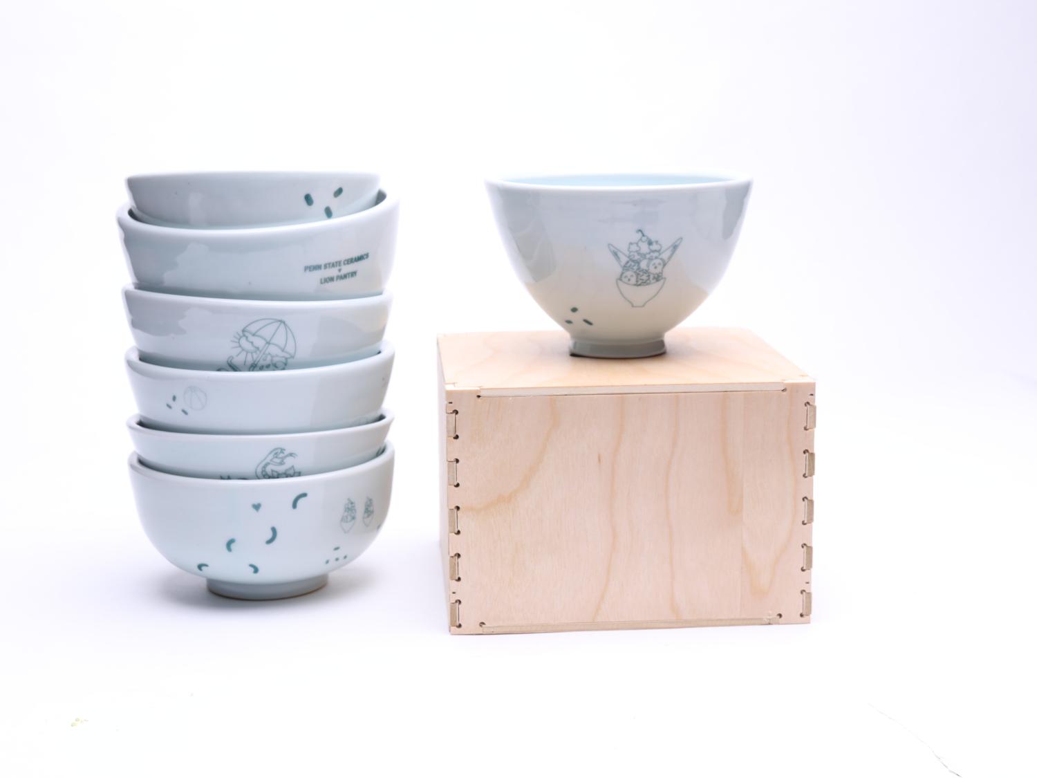 Stack of bowls and bowl on a wooden box