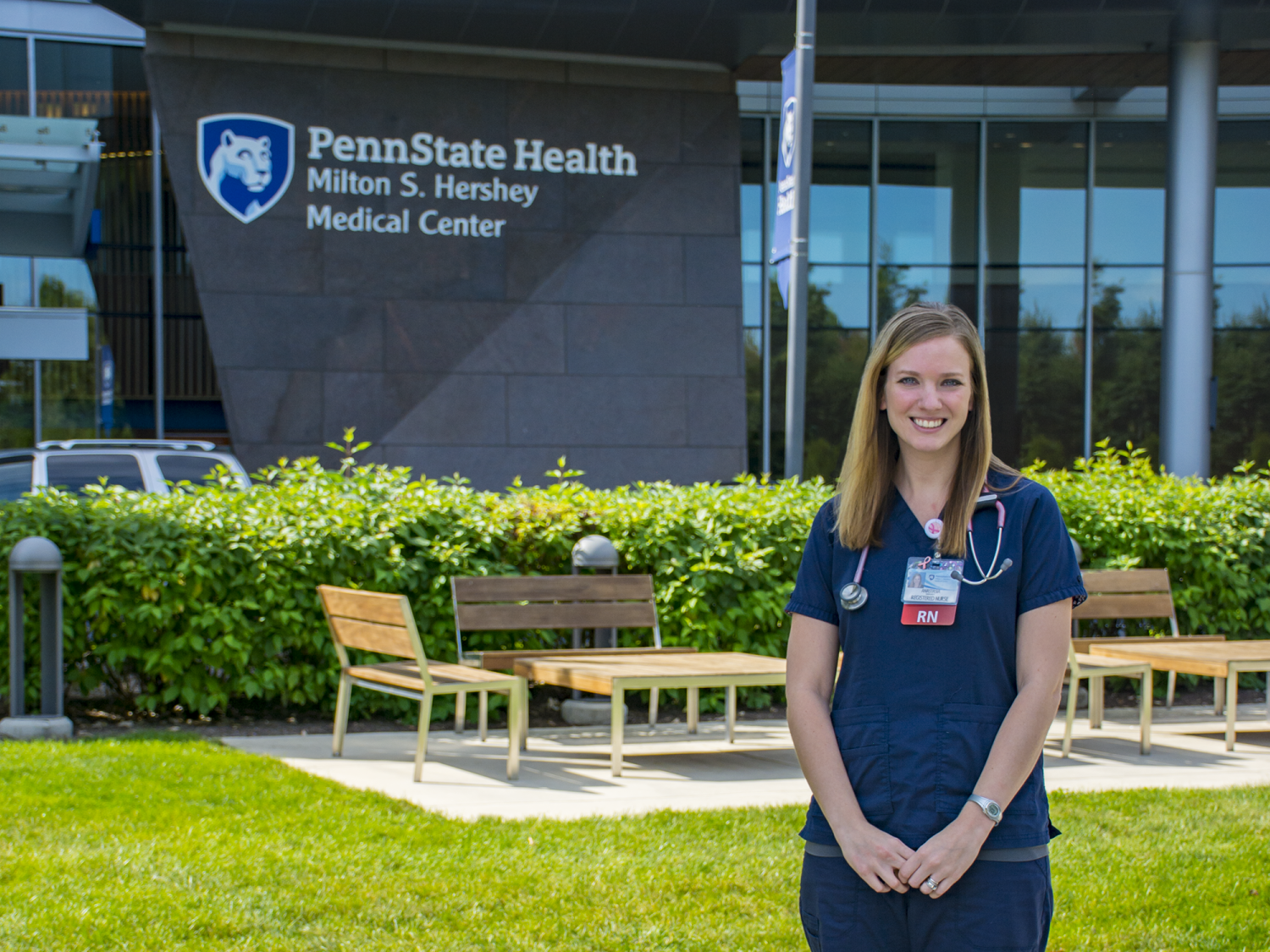 Anastasia Barnhardt stands in front of Penn State Health Milton S. Hershey Medical Center.
