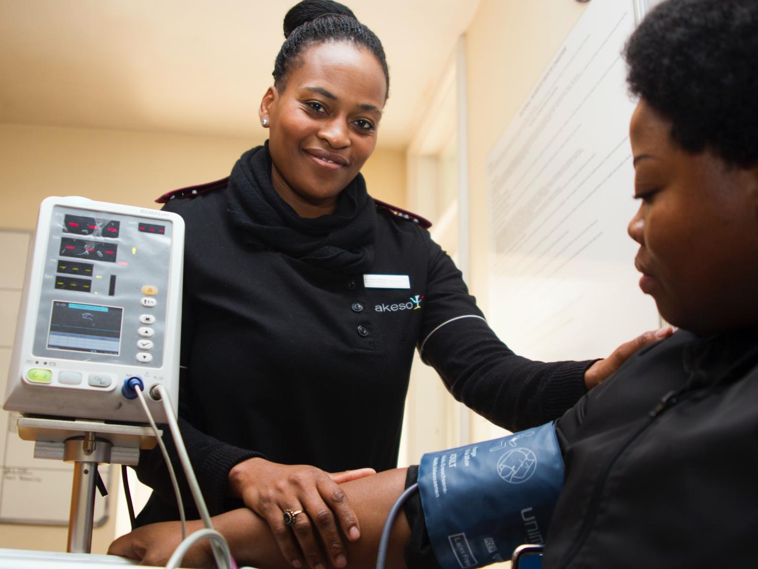 Woman having her blood pressure taken