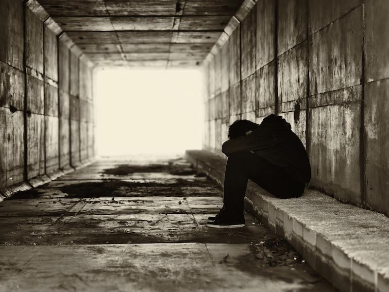 Silhouette of a boy in a tunnel