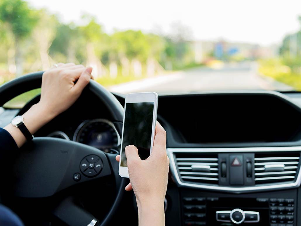 Woman texting while driving