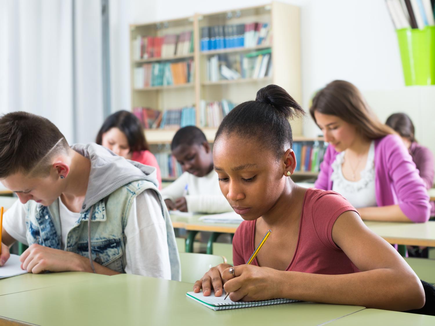 Teens at their desks in school